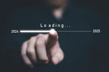 Businessman touching to downloading bar to change 2024 to 2025 year for change and preparation new...