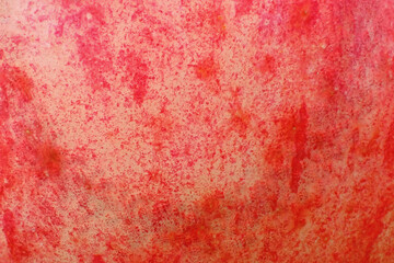 Macro close-up shot of red apple peel texture background.