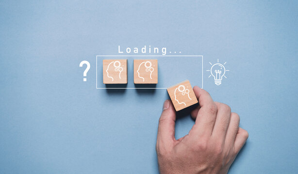 Hand assemble human thinking icon to loading bar from question mark to glowing lightbulb for creative thinking ideas and problem solving solution concept. - Powered by Adobe