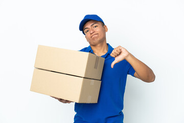 Delivery Ecuadorian man isolated on white background showing thumb down with negative expression