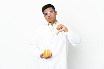 Young Ecuadorian scientific man showing thumb down with negative expression