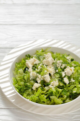 Classic Greek green lettuce salad with feta cheese