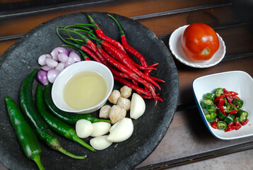 ingredients for making sambal. traditional Indonesian sambal with a mortar or pestle