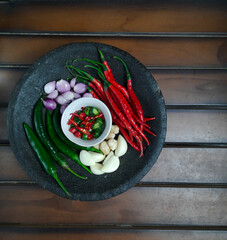 ingredients for making sambal. traditional Indonesian sambal with a mortar or pestle