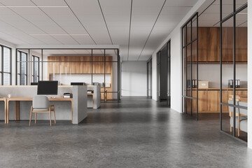 Open office space featuring concrete desks and wooden cabinets, modern design with glass partitions, large windows, and a professional atmosphere. 3D Rendering