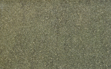 Green grainy ceramic chips texture as background