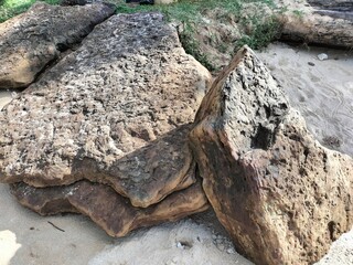 Natural stone piles with beach sand