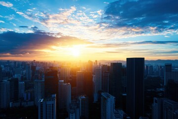 Fototapeta premium Skyline at sunset, cityscape with buildings silhouetted against colorful clouds.