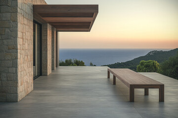 Serene terrace with wooden bench overlooking the ocean at sunset in a coastal setting