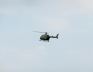 A military helicopter pilot demonstrates the technical skills and capabilities of the helicopter