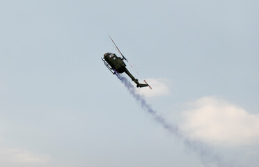 A military helicopter pilot demonstrates the technical skills and capabilities of the helicopter