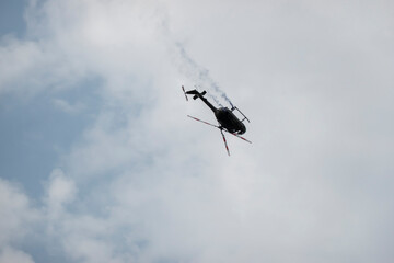 A military helicopter pilot demonstrates the technical skills and capabilities of the helicopter