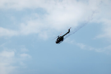 A military helicopter pilot demonstrates the technical skills and capabilities of the helicopter