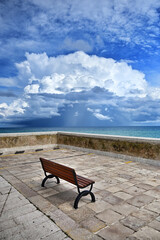 Large storm clouds over the sea as seen from the waterfront