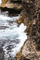 Waves Crashing Against Coastal Rocks
