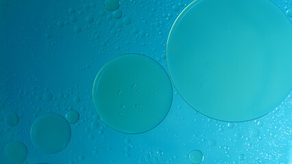 nice background, abstract background of oil bubbles on water with blue light