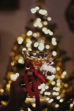 Elegant Wine Glasses Adorned with Festive Holiday Decor at a Cozy Christmas Party looking soo intersting party 