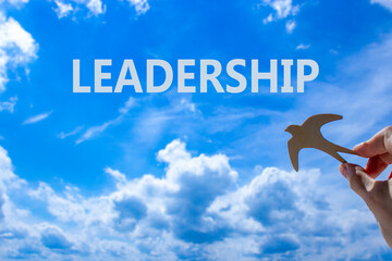 Leadership symbol. Concept word Leadership on beautiful blue sky. Beautiful blue sky and clouds...