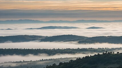 Fototapeta premium A foggy morning sky with thick clouds hanging low, shrouding distant hills and creating a peaceful, quiet scene 