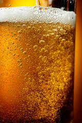 Glass of tasty beer with foam, closeup.