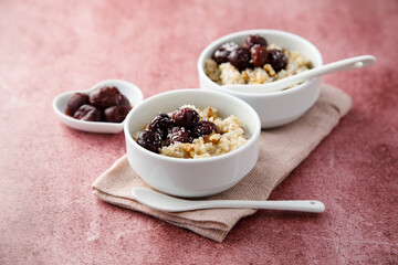 Homemade pudding with warm cherries and coconut