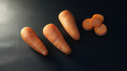 carrots. some carrots on a black background