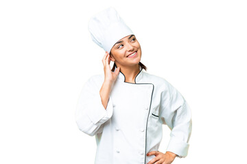 Young woman Chef over isolated chroma key background thinking an idea