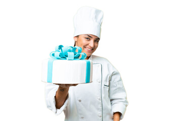 Woman pastry chef with a big cake with happy expression