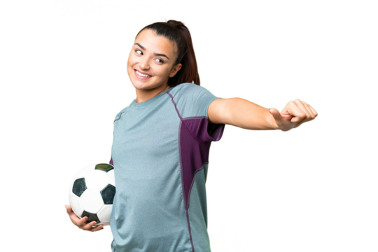 Young football player Woman over isolated chroma key background giving a thumbs up gesture - Powered by Adobe
