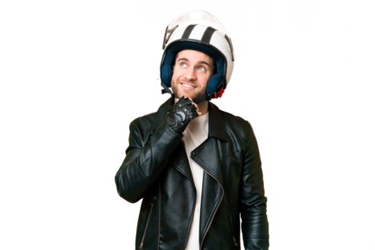 Young handsome blonde man with a motorcycle helmet over isolated chroma key background and looking up
