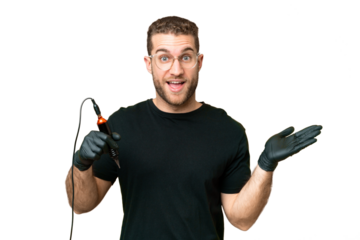 Tattoo artist man over isolated chroma key background with shocked facial expression