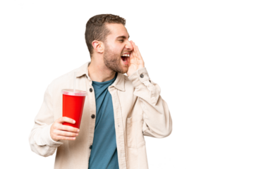 Young handsome blonde man holding soda over isolated chroma key background shouting with mouth wide open to the side