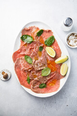 Beef carpaccio with lime and spinach