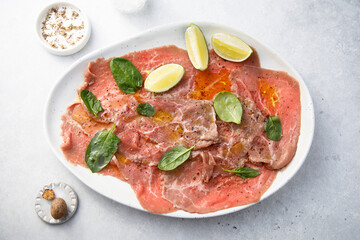 Beef carpaccio with lime and spinach