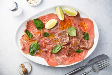 Beef carpaccio with lime and spinach