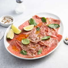 Beef carpaccio with lime and spinach