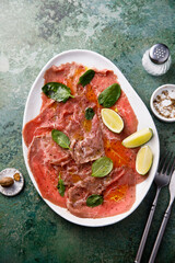 Beef carpaccio with lime and spinach