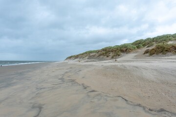 sandy beach in ouddorp, the netherlands, in bad cloudy autumn weather