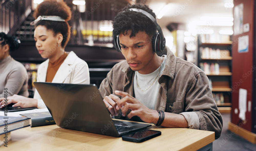 Leinwandbilder man, studying or laptop in library with headphones, problem solving or working on research assignmen