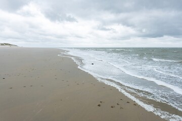 sandy beach in ouddorp, the netherlands, in bad cloudy autumn weather