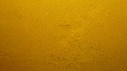 yellow wall texture. The texture background of the wall with yellow paint has a rough surface