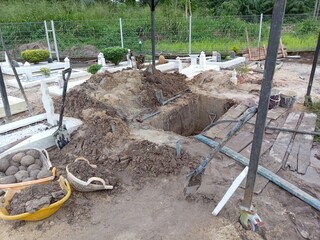 Muslim malay cemetary newly dug  empty grave hole in a rainy season. special measure must be taken...