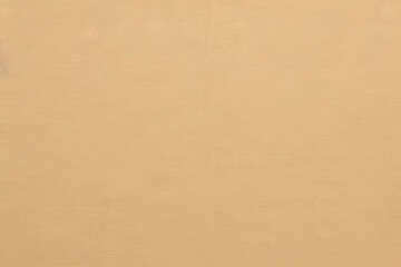 Obraz premium A close-up view of a beige textured fabric with a subtle woven pattern.