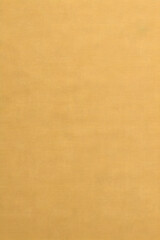 Fototapeta premium A close-up view of a beige textured fabric with a subtle woven pattern.