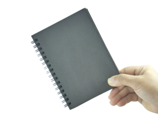 Female hand holding notebook isolated on transparent background.