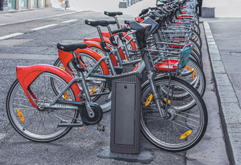 Healthy ecology urban transportation, concept,  closeup many manual city bikes parked in row at Lyon city center for rental. Sport environmental transport infrastructure side seeing concept.