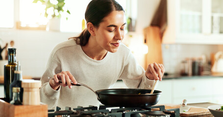 Female person, aroma and cooking as chef in kitchen for diet or recipe in home for satisfaction....