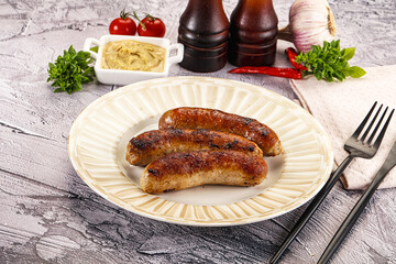 Delicous natural roasted sausages in the plate