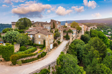 Menerbes village in Provence on a summer day, France, Luberon, Vaucluse. Village of Menerbes, the village and the Luberon mountains also called the most beautiful village of Luberon, France, Provence.