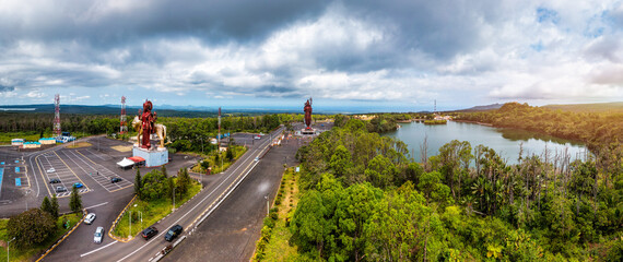 A powerful Statue of the Hindu goddess Durga Maa with a golden lion in sacred Ganga Talao. Shiva...